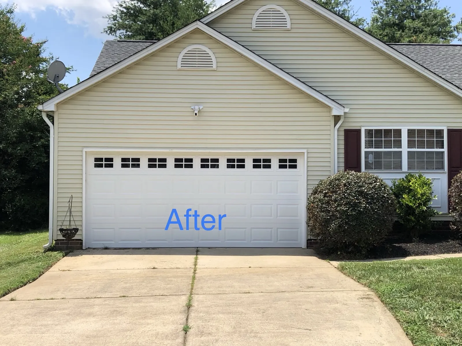 A home with its newly replaced white garage door